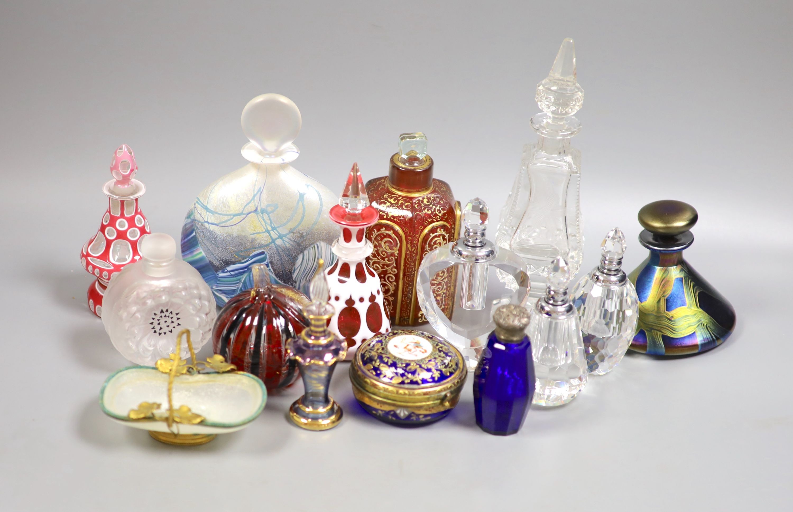 A collection of various glass scent bottles including a Lalique flower scent bottle and Bohemian examples, tallest 20.5cm